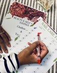 pic of woman writing on savings challenge page to save for nail care